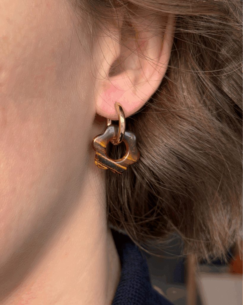 helloso porte pampille fleur oeil tigre lisse