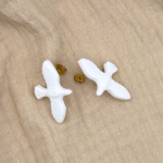 puce oiseau blanc bijou